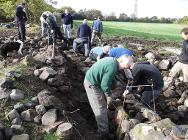 Dry stone wallers taking part in a course