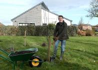 Cllr Joe Porter planting trees for the community orchard at Haregate